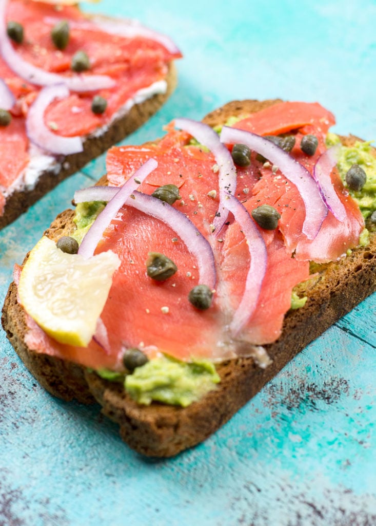 This easy smoked salmon toast can be made two ways for a healthy no-cook breakfast or post-workout snack. With a cream cheese or avocado spread and topped with smoked salmon, this protein packed breakfast will keep you going all morning!