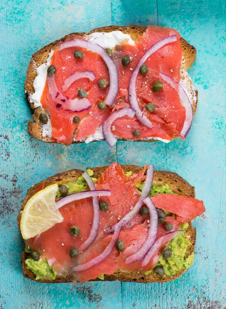 This easy smoked salmon toast can be made two ways for a healthy no-cook breakfast or post-workout snack. With a cream cheese or avocado spread and topped with smoked salmon, this protein packed breakfast will keep you going all morning!