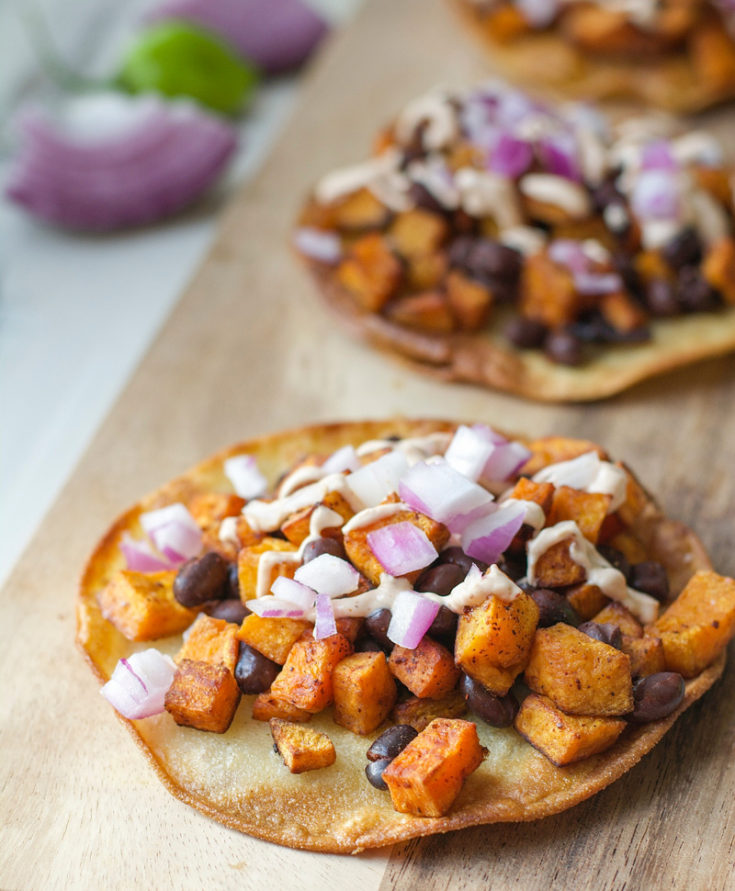 These vegetarian Sweet Potato Black Bean Tostadas with Chipotle Cream are full of flavor, protein, and fiber! Everyone will enjoy this healthy dinner!