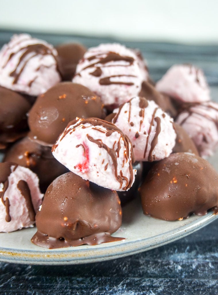 Keto Chocolate Covered Strawberry Fat Bombs are the perfect sweet to treat yourself with this Valentine's Day! With only 0.8 net carbs per ball, you will be hooked!