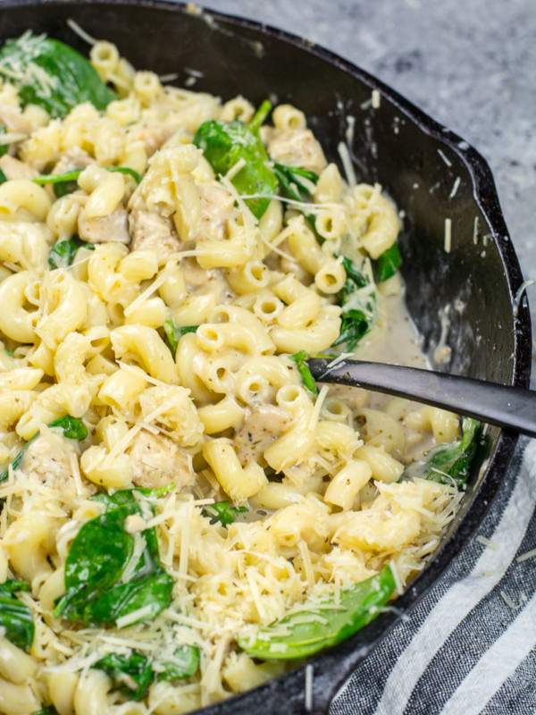 This Cheesy Chicken and Spinach Pasta is a quick one-pan dinner that is made with kitchen staples and only takes 30 minutes!