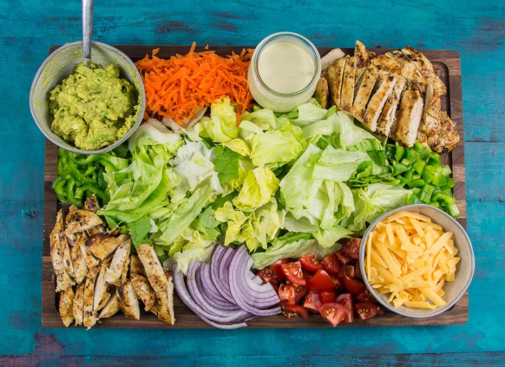 This Chicken Taco Salad Board is put together with fresh ingredients for everyone to enjoy! Bring everyone together this Taco Tuesday with a beautiful entertaining board.