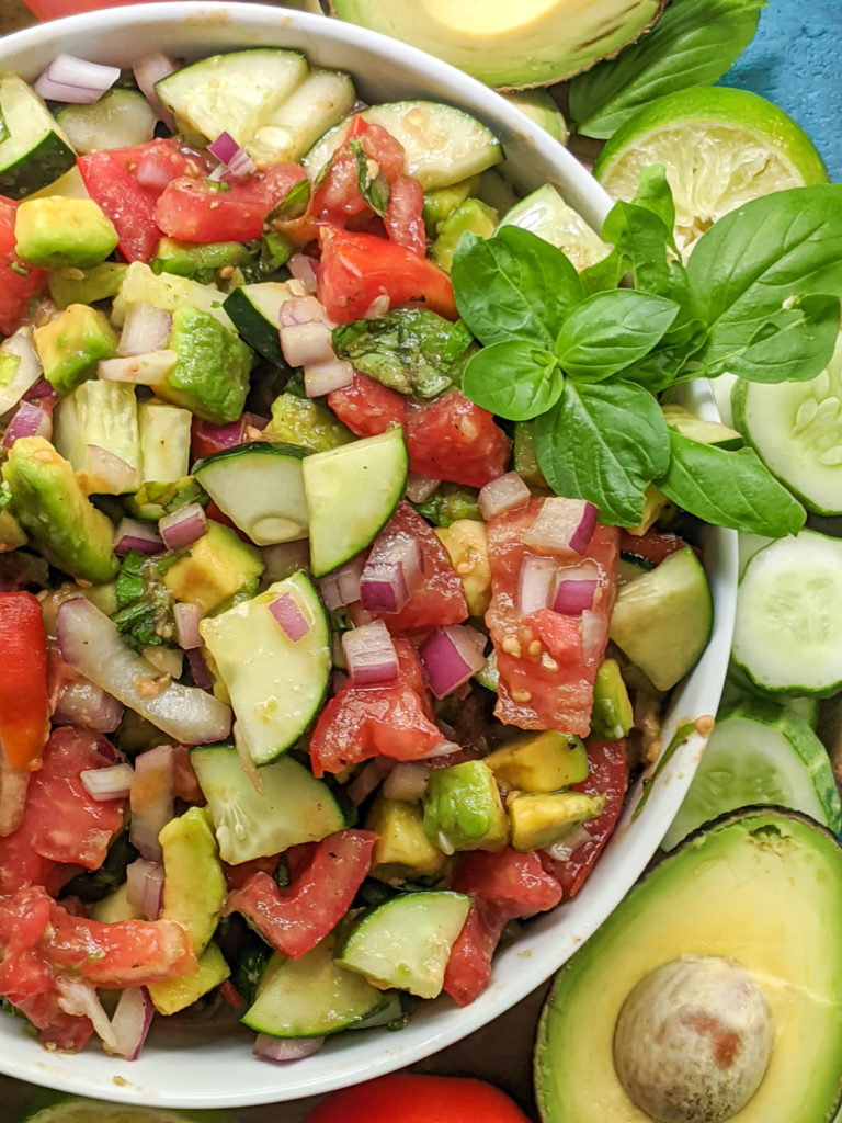Delicious side salad packed with fresh cucumbers, tomatoes, avocado, basil, and more! Paleo, Whole30, and Vegan friendly as well as dairy-free, gluten-free, and sugar-free. Easy, satisfying, and only 8 ingredients. 