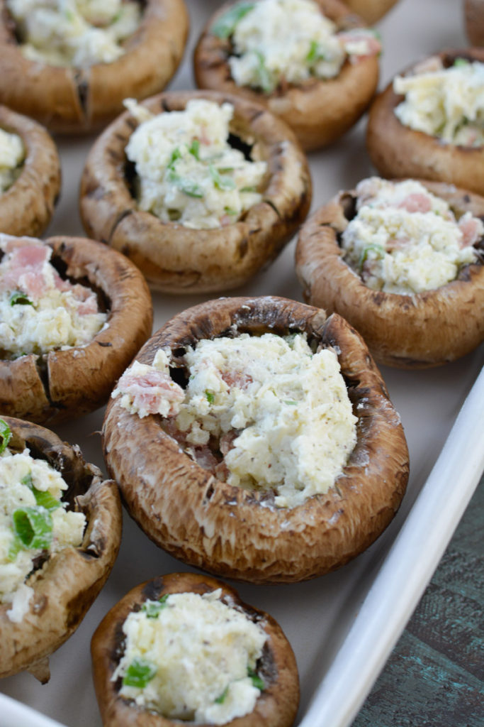 These easy Prosciutto and Parmesan Stuffed Mushrooms are loaded with prosciutto, cheese, herbs, and spices! This is the perfect low carb keto dinner or appetizer at about 5 net carbs per serving!