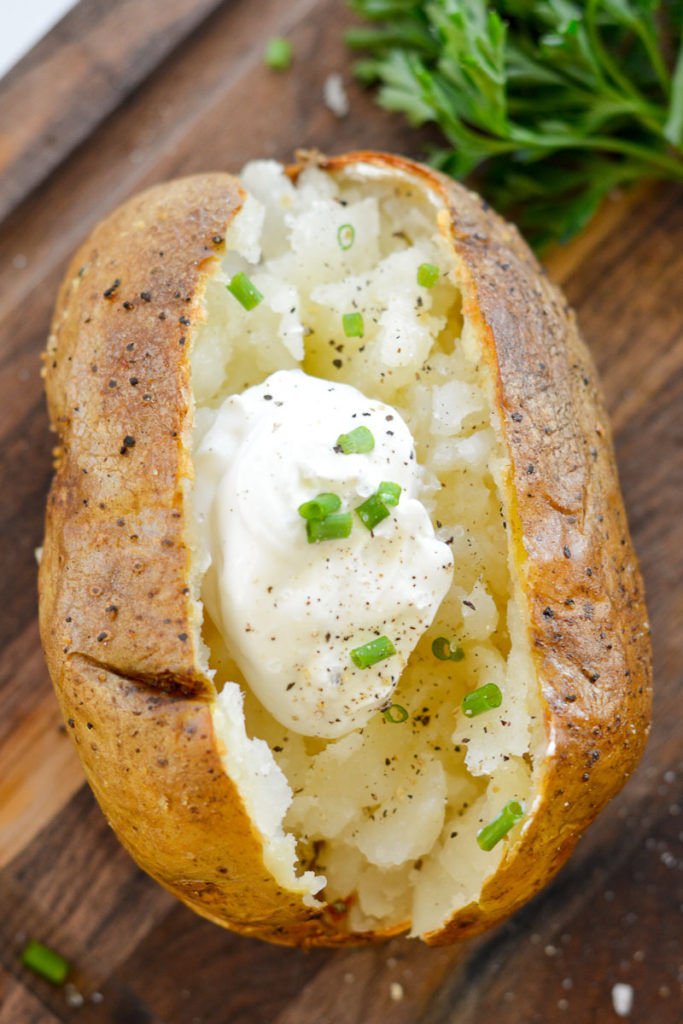 Air Fryer Baked Potatoes have a super crispy outside, soft, fluffy & tender inside and only take 40 minutes. 