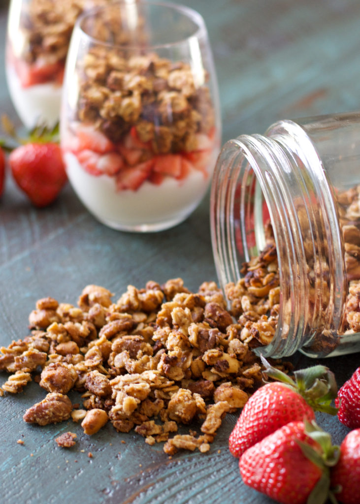 This Homemade Peanut Butter Granola is loaded with healthy ingredients, and comes together in just a few minutes! You can use this granola for healthy fruit parfaits, smoothie bowls, or a crunchy snack!