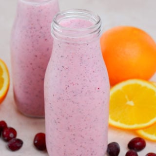 This Healthy Berry Orange Smoothie is loaded with frozen cranberries, fresh orange juice and Greek yogurt! Start your day strong with this nutritious smoothie recipe!