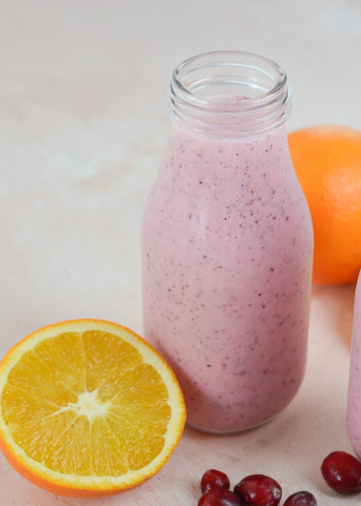 This Healthy Berry Orange Smoothie is loaded with frozen cranberries, fresh orange juice and Greek yogurt! Start your day strong with this nutritious smoothie recipe!