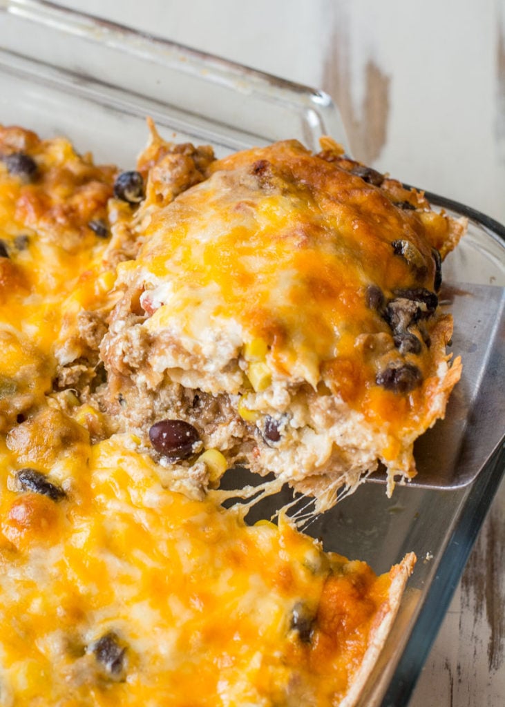 Layered Taco Casserole is a kid-friendly, gluten free casserole that is loaded with taco meat, beans and cheese! 