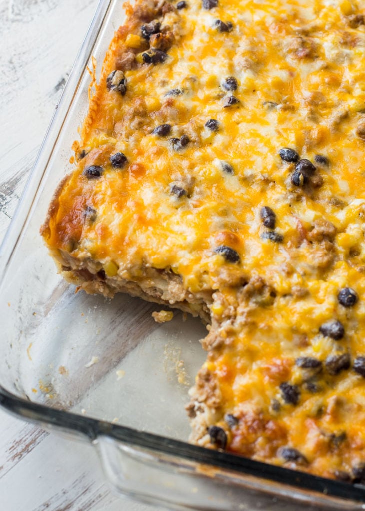 Layered Taco Casserole is a kid-friendly, gluten free casserole that is loaded with taco meat, beans and cheese! 