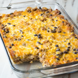 Layered Taco Casserole is a kid-friendly, gluten free casserole that is loaded with taco meat, beans and cheese!