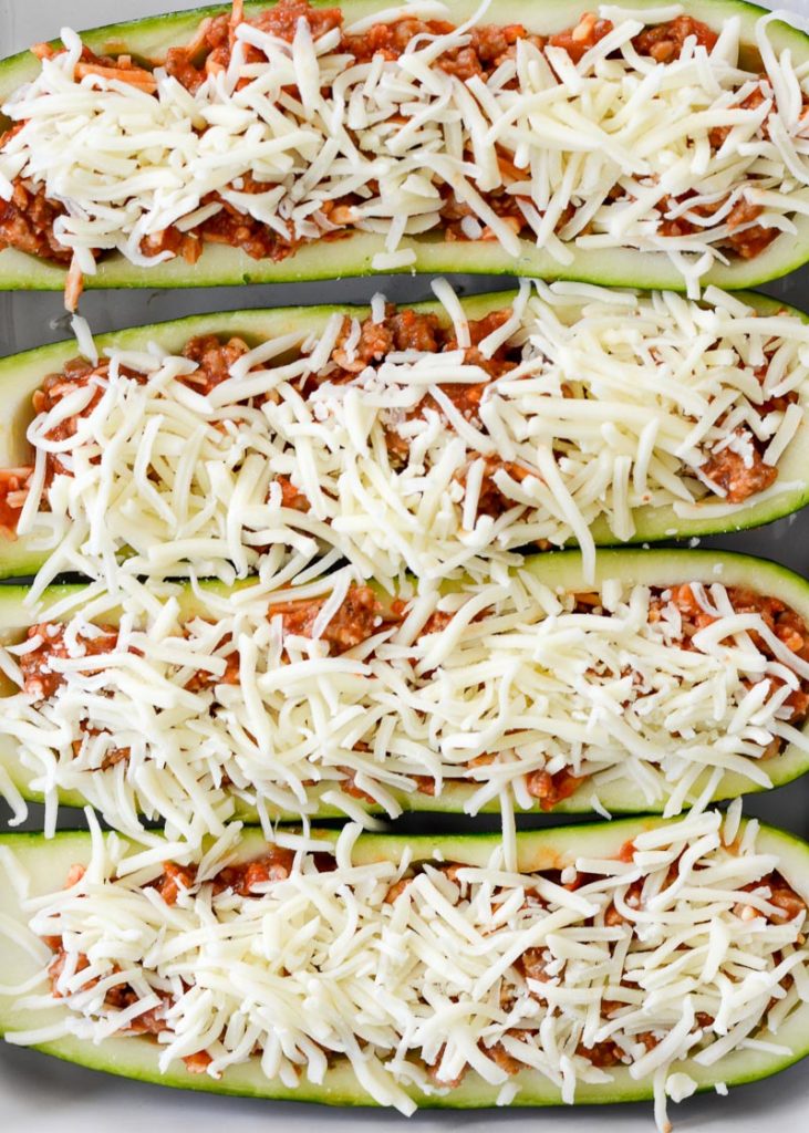 You only need five basic ingredients for these flavor-packed Air Fryer Pizza Zucchini Boats! Never miss a pizza night with this keto zucchini boat (only 2 net carbs apiece)!