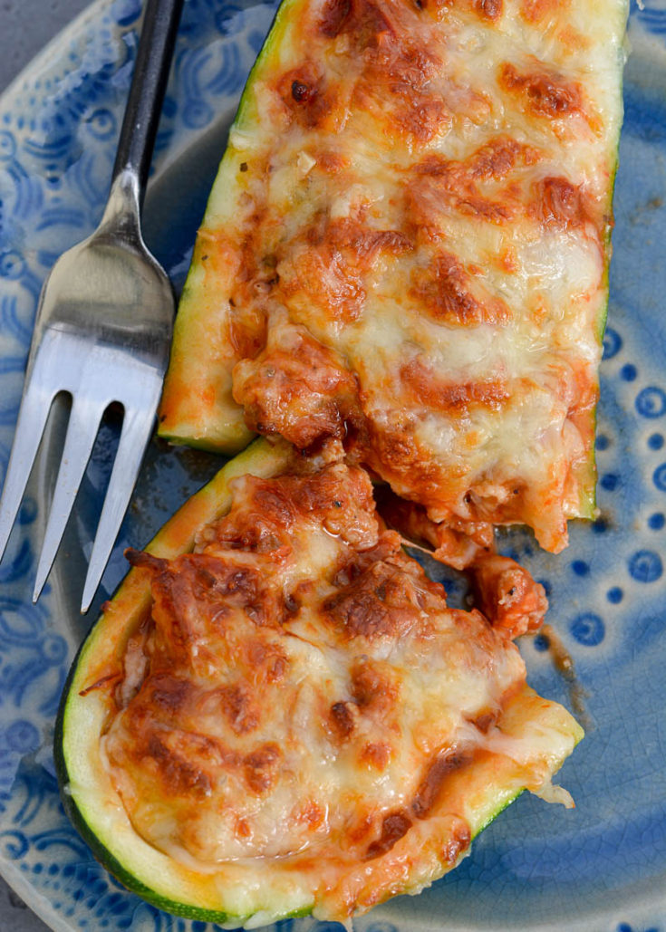 You only need five basic ingredients for these flavor-packed Air Fryer Pizza Zucchini Boats! Never miss a pizza night with this keto zucchini boat (only 2 net carbs apiece)!
