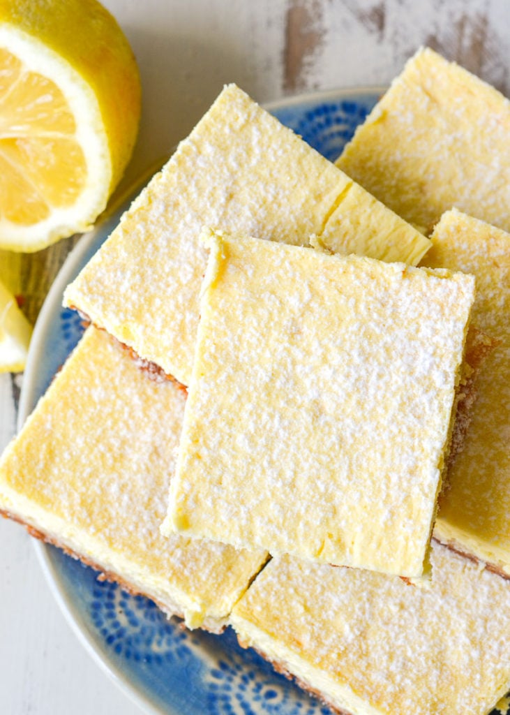 Delightful Keto Lemon Cheesecake Bars that are the perfect combination of sweet and tart! Each slice has about 2 net carbs!