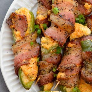 These Keto Jalapeno Poppers are loaded with two kinds of cheese and wrapped in pepper bacon! This easy low carb appetizer can be made in the oven, on the grill or in the air fryer!