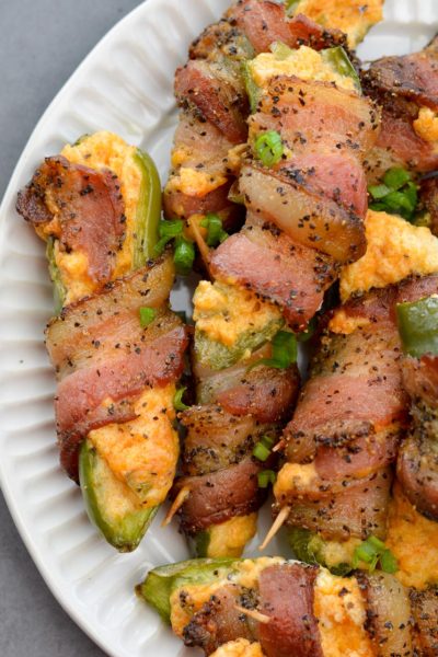 These Keto Jalapeno Poppers are loaded with two kinds of cheese and wrapped in pepper bacon! This easy low carb appetizer can be made in the oven, on the grill or in the air fryer!