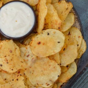 Learn how to make homemade potato chips that are baked instead of fried! This recipe only requires three ingredients and takes less than 20 minutes!