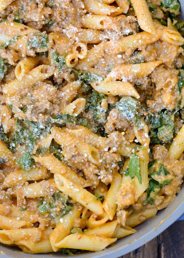 This Sausage and Butternut Squash Pasta features a creamy, lightened up pasta sauce, fresh kale and browned Italian sausage. This is the perfect family friendly dinner recipe that is ready in about 30 minutes! 