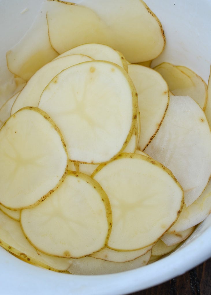 Learn how to make homemade potato chips that are baked instead of fried! This recipe only requires three ingredients and takes less than 20 minutes! 