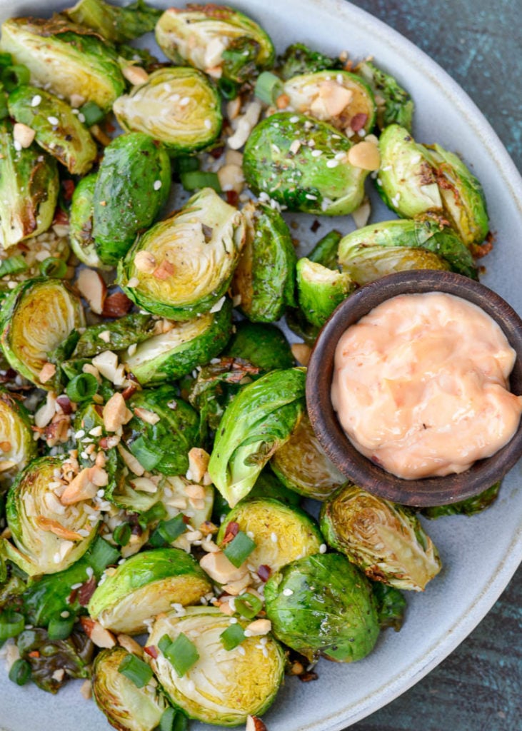 These crispy Air Fryer Brussels Sprouts are ready in 10 minutes and are served with an easy 3-ingredient Asian dipping sauce! They make the best keto appetizer or side dish for a busy night!