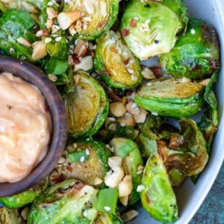 These crispy Air Fryer Brussels Sprouts are ready in 10 minutes and are served with an easy 3-ingredient Asian dipping sauce! They make the best keto appetizer or side dish for a busy night!