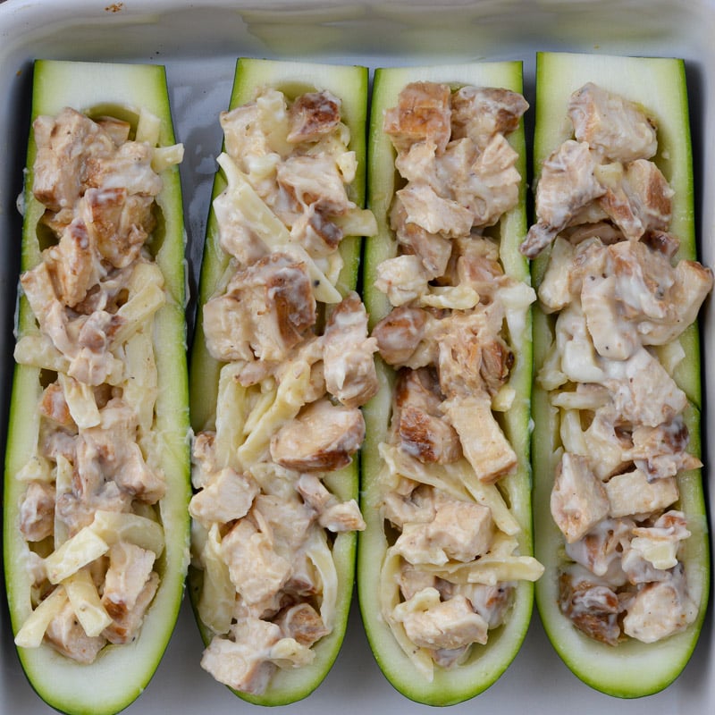 Chicken Alfredo Zucchini Boats are an easy weeknight meal! Stuffed zucchini boats filled with chicken, alfredo and cheese. This low carbohydrate, high protein meal will leave you feeling satisfied!
