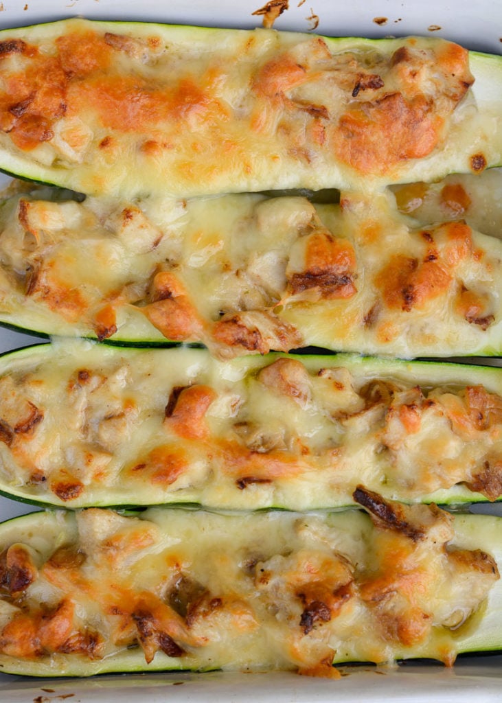 Chicken Alfredo Zucchini Boats are an easy weeknight meal! Stuffed zucchini boats filled with chicken, alfredo and cheese. This low carbohydrate, high protein meal will leave you feeling satisfied!
