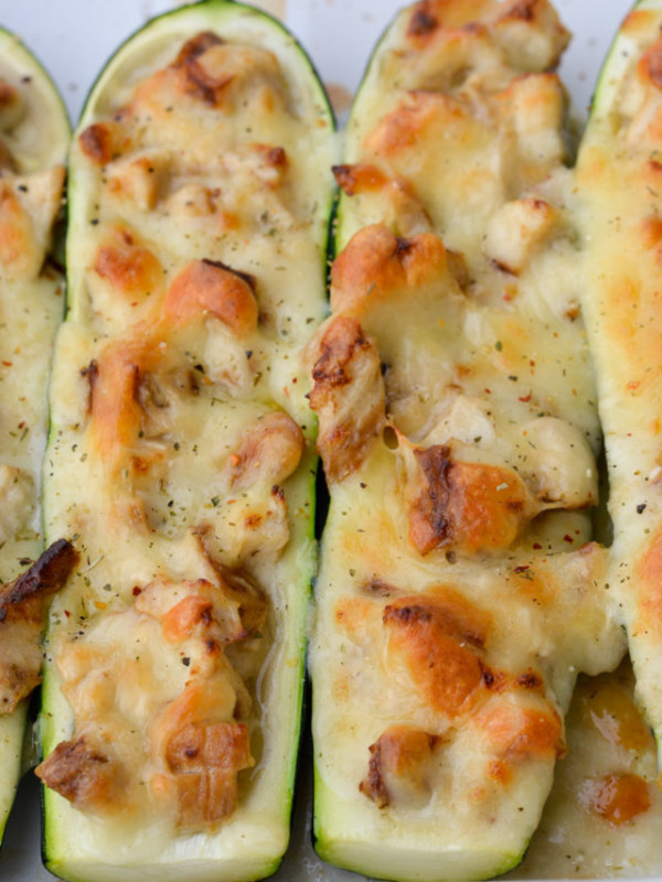 Chicken Alfredo Zucchini Boats are an easy weeknight meal! Stuffed zucchini boats filled with chicken, alfredo and cheese. This low carbohydrate, high protein meal will leave you feeling satisfied!