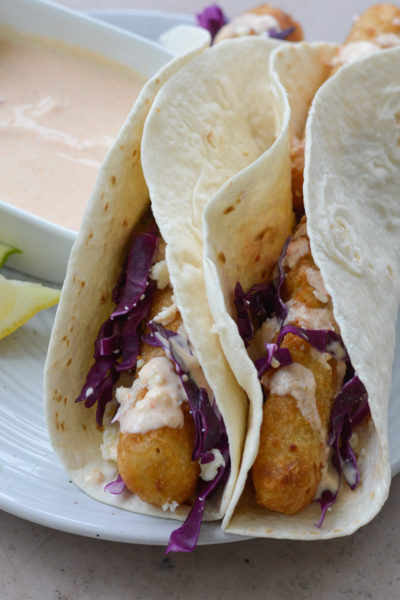 These easy Air Fryer Fish Tacos are ready in 20 minutes! Cooking frozen fish in the air fryer gives you perfectly crispy tacos with barely any work at all!