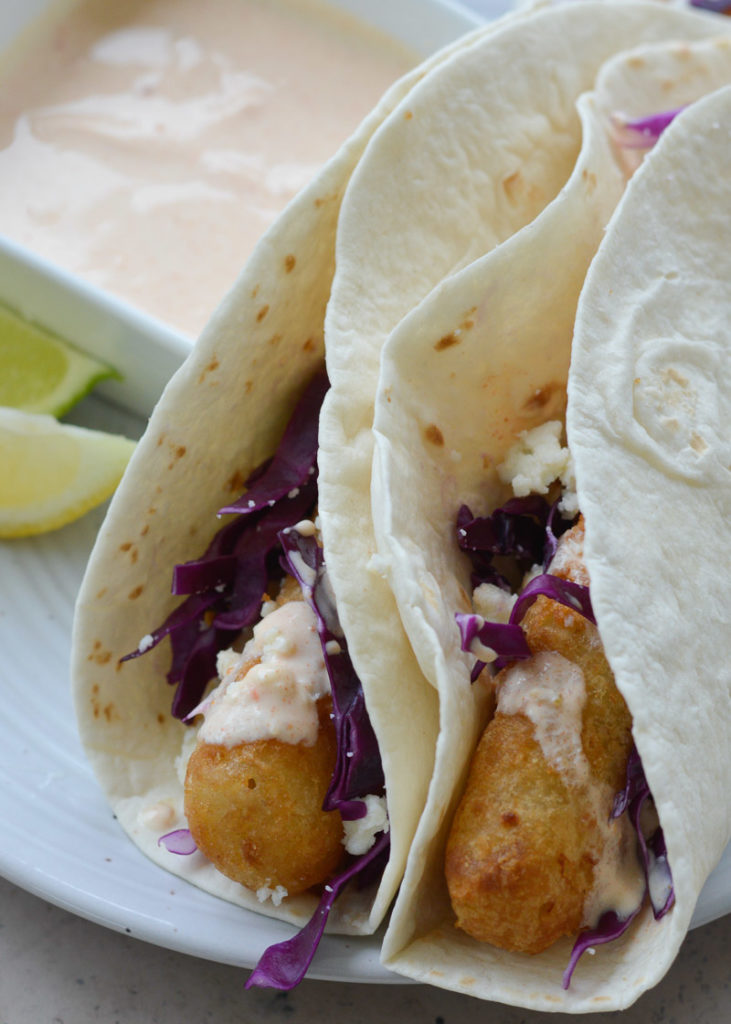 These easy Air Fryer Fish Tacos are ready in 20 minutes! Cooking frozen fish in the air fryer gives you perfectly crispy tacos with barely any work at all!