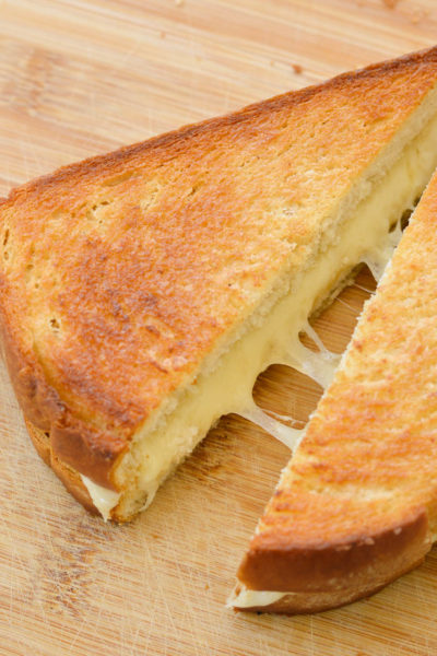This Air Fryer Grilled Cheese makes for an easy meal in just 10 minutes! Gouda and Havarti make for a delicious, gooey sandwich with perfectly crispy sourdough bread!