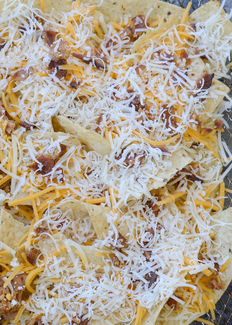 These easy Air Fryer Nachos are the best snack, ready in just 5 minutes! Customize your toppings using your favorite cheeses, leftover taco meat, bacon, and more!