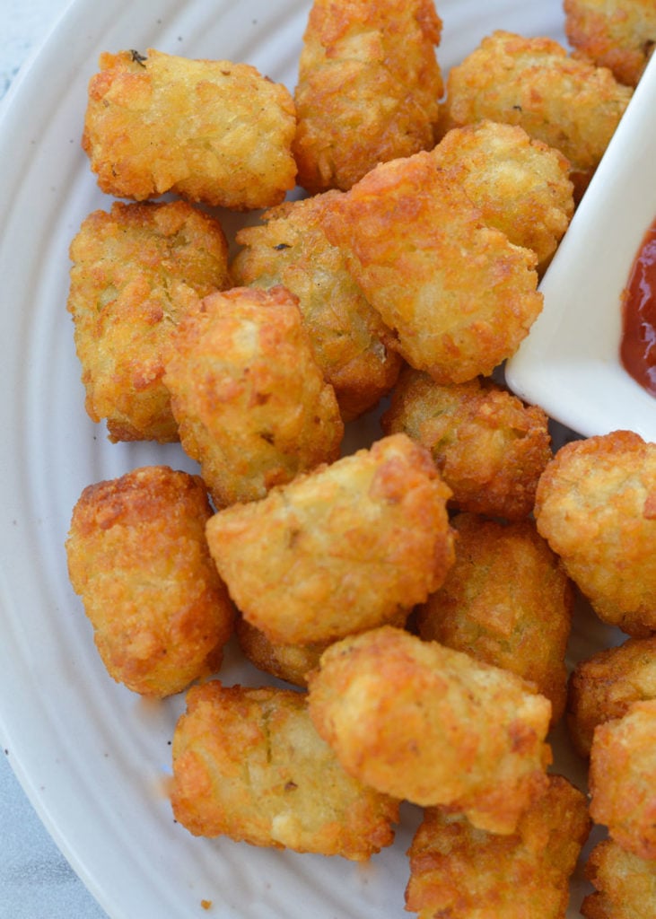 Learn how to make deliciously crunchy Air Fryer Tater Tots! You'll have the perfect gluten free side dish in just minutes!