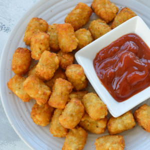 Learn how to make deliciously crunchy Air Fryer Tater Tots! You'll have the perfect gluten free side dish in just minutes!