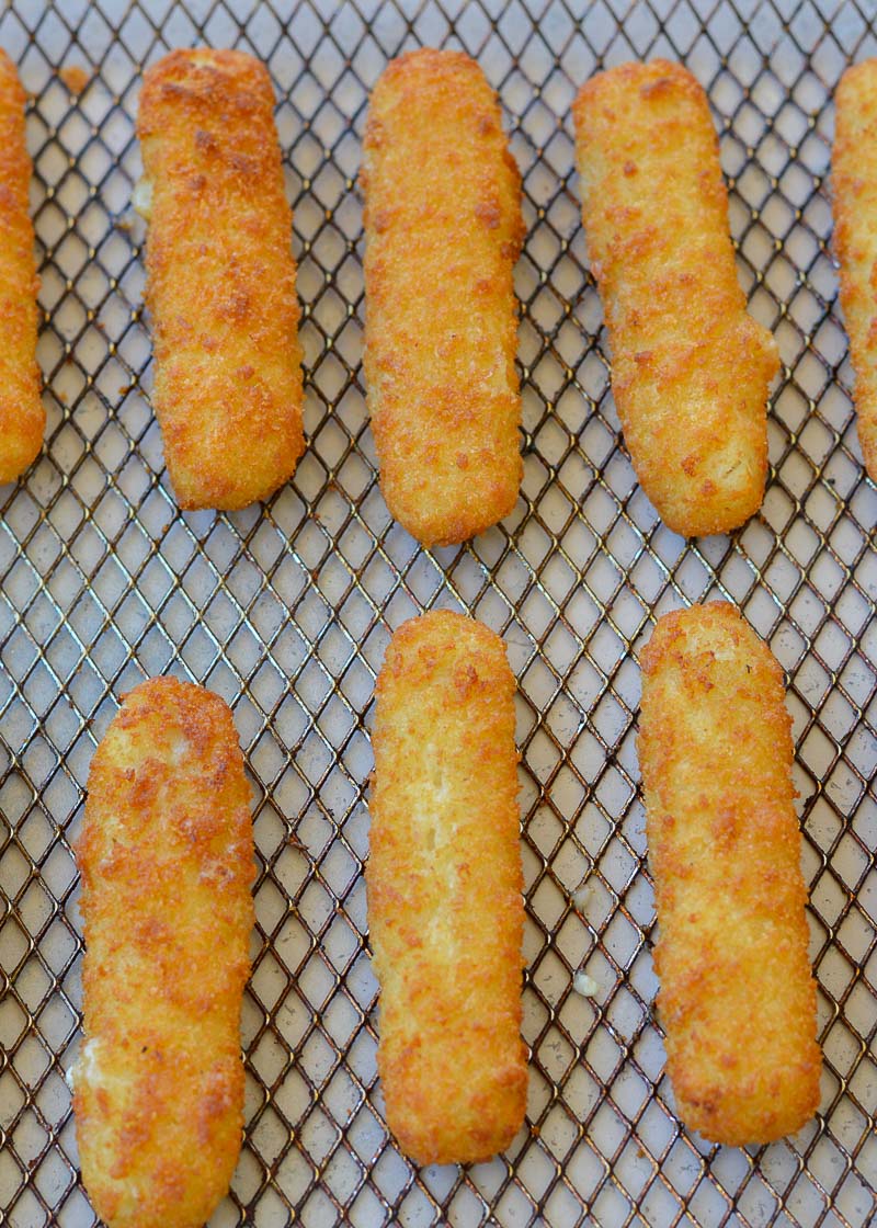 Air Fryer Fish Sticks are quick, easy, and perfectly crispy! Learn the perfect time and temperature to cook the perfect Air Fryer Frozen Fish Sticks!
