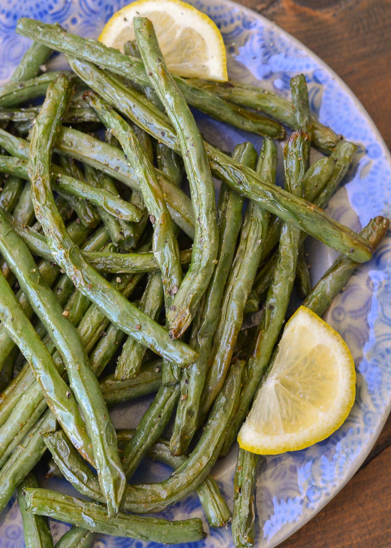 Learn how to make easy Air Fryer Green Beans! Fresh green beans are paired with seasoning and lemon to make the perfect keto side dish!