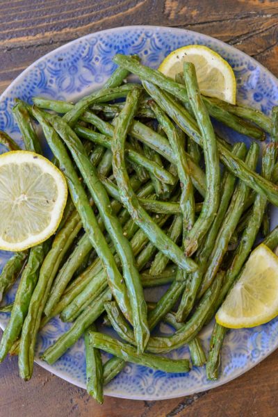Learn how to make easy Air Fryer Green Beans! Fresh green beans are paired with seasoning and lemon to make the perfect keto side dish!