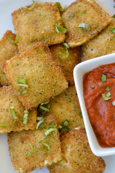 This Air Fryer Ravioli makes the ultimate easy appetizer! Frozen ravioli becomes perfectly crispy, this is great to serve along with fresh marinara or pesto!