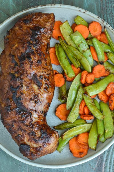 This Asian Pork Tenderloin with Air Fryer Vegetables is the perfect 15 minute meal! This weeknight dinner recipe is easy, healthy and everyone in your family will love it!