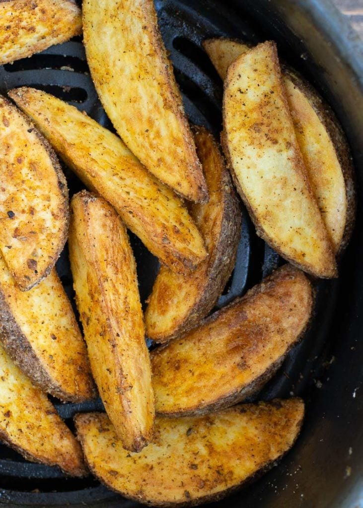 Make the BEST Air Fryer Potato Wedges that are ultra crispy on the outside and fluffy on the inside! This easy air fryer recipes requires just four ingredients and is ready in under 15 minutes!