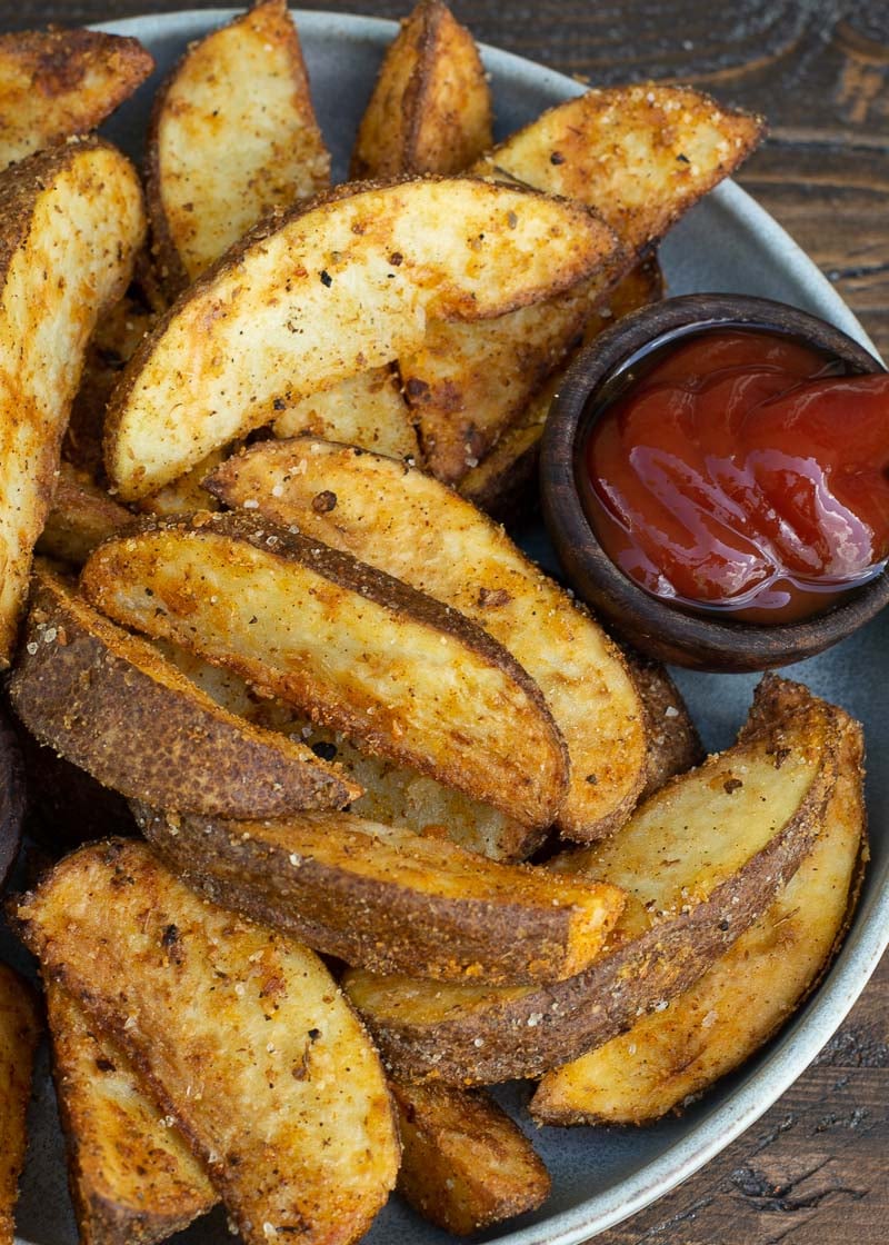 Make the BEST Air Fryer Potato Wedges that are ultra crispy on the outside and fluffy on the inside! This easy air fryer recipes requires just four ingredients and is ready in under 15 minutes!