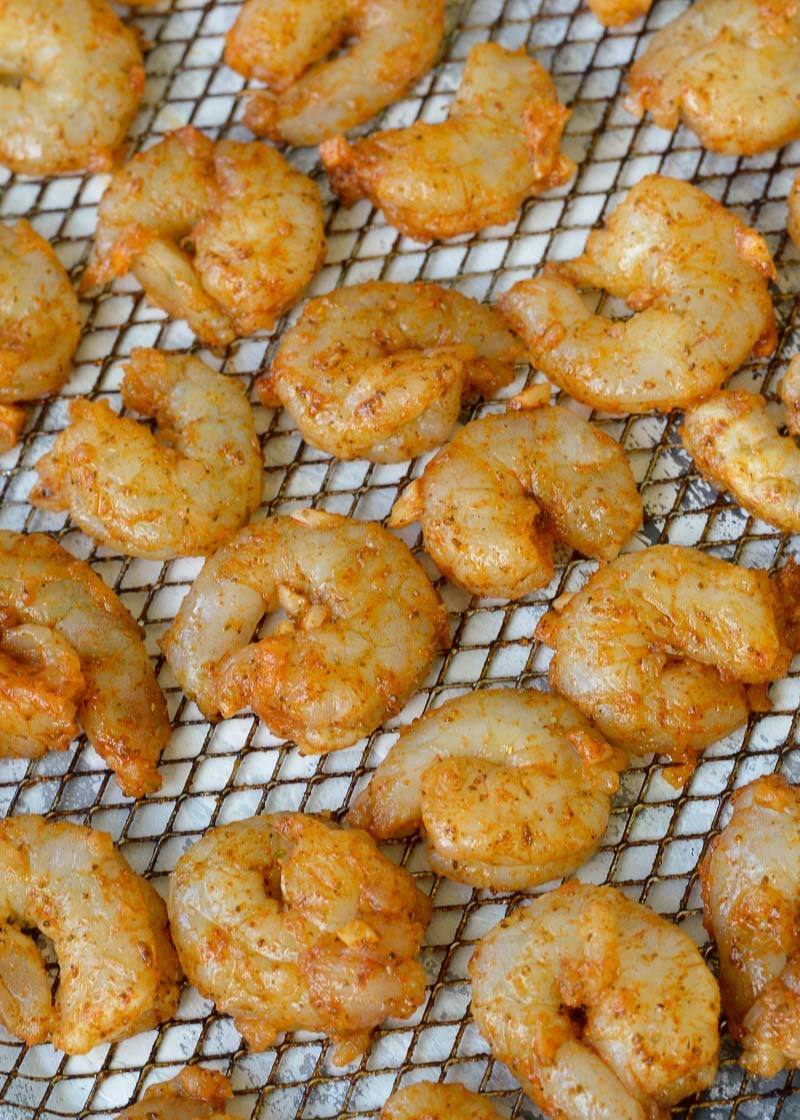 This Air Fryer Shrimp is ready in 10 minutes and great for keto meal prep! Under 1 net carb per serving, it's the perfect addition to salads, wraps, tacos, noodles, and more!