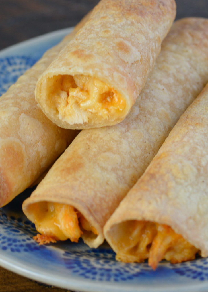 Your whole family won't be able to get enough of these Chicken Taquitos! This easy dinner recipe is loaded with chicken, cheese and buffalo sauce and is ready in under 10 minutes!