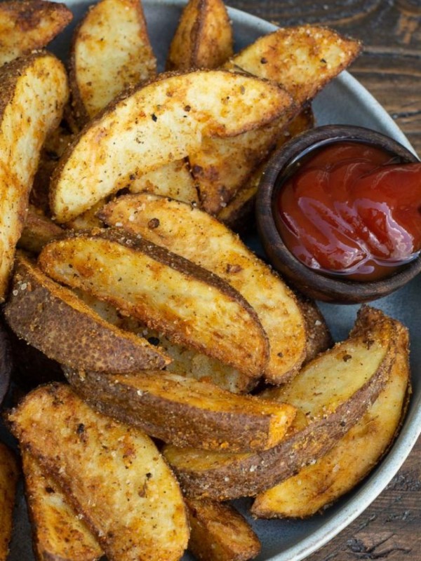 Make the BEST Air Fryer Potato Wedges that are ultra crispy on the outside and fluffy on the inside! This easy air fryer recipes requires just four ingredients and is ready in under 15 minutes!