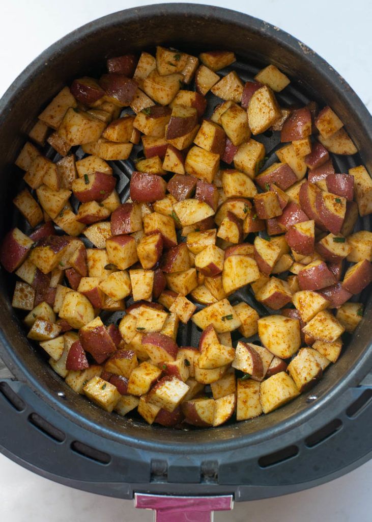 These Air Fryer Breakfast Potatoes require just four ingredients and 15 minutes! These crispy, salty breakfast potatoes are great with bacon and eggs! 