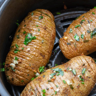 These Air Fryer Hasselback Potatoes are going to become your go-to side dish! This easy potato recipe is ready in only 15 minutes and is packed with fresh herb flavor!