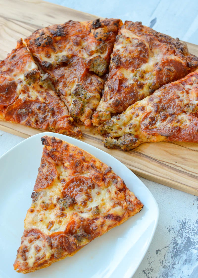 Learn how to reheat pizza in the air fryer for the BEST leftovers! Enjoy a perfectly crisp crust and gooey cheese with these reheating tips.