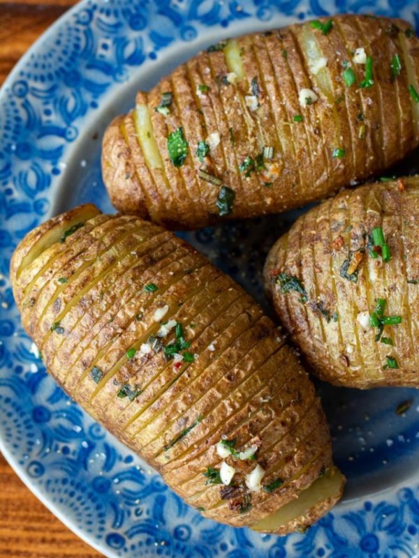 These Air Fryer Hasselback Potatoes are going to become your go-to side dish! This easy potato recipe is ready in only 15 minutes and is packed with fresh herb flavor!