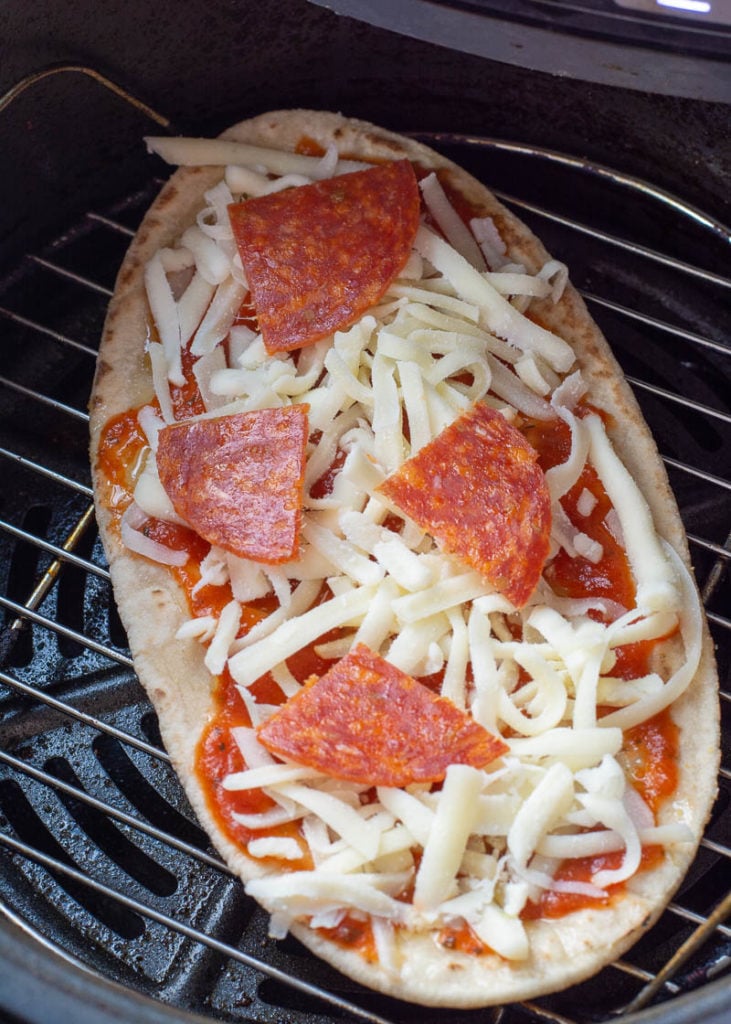 This Air Fryer Pizza requires just 7 minutes of cooking time! You can make your favorite pizza with a crispy, crunchy crust right in your air fryer! This is the perfect weeknight pizza recipe.   