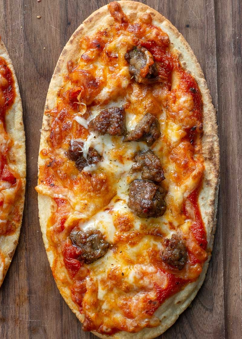 This Air Fryer Pizza requires just 7 minutes of cooking time! You can make your favorite pizza with a crispy, crunchy crust right in your air fryer! This is the perfect weeknight pizza recipe.